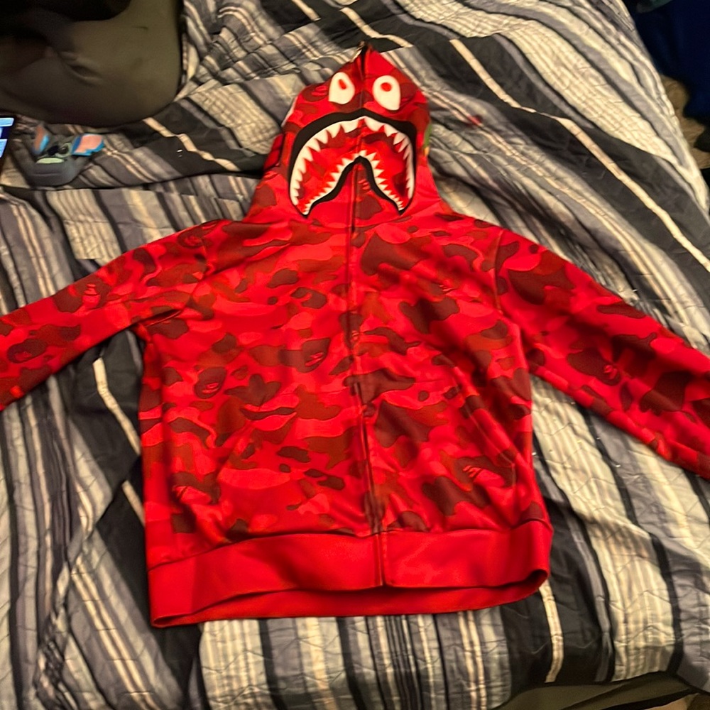 Red official nape hoodie. Medium in size